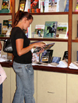 Someone looking through one of our many books at the Lendon F. Grey bookstore